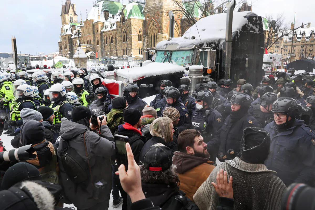 Police confront demonstrators in Ottawa on Feb. 19, 2022. (Scott Olson/Getty Images)