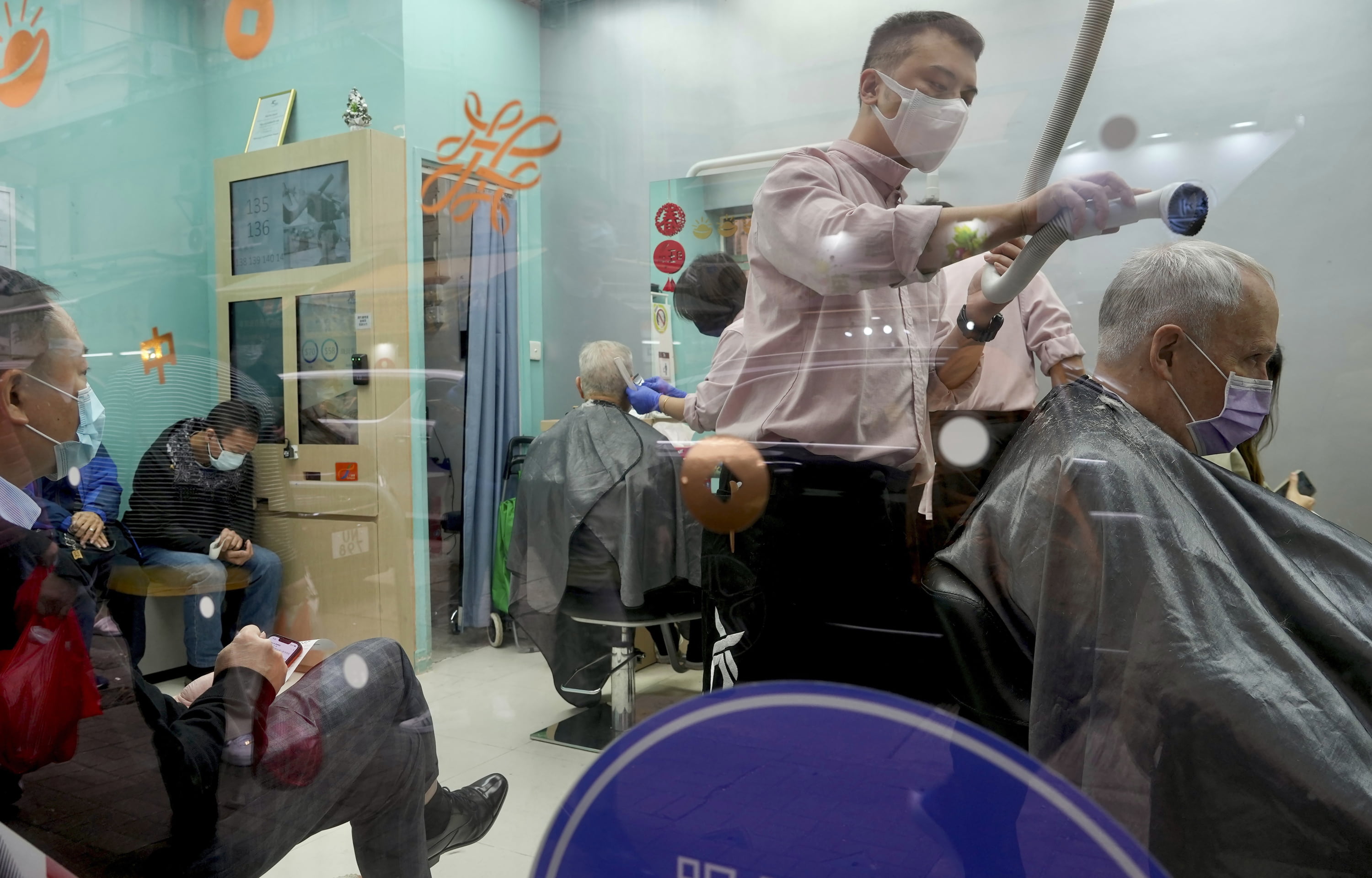 People get haircuts in Hong Kong