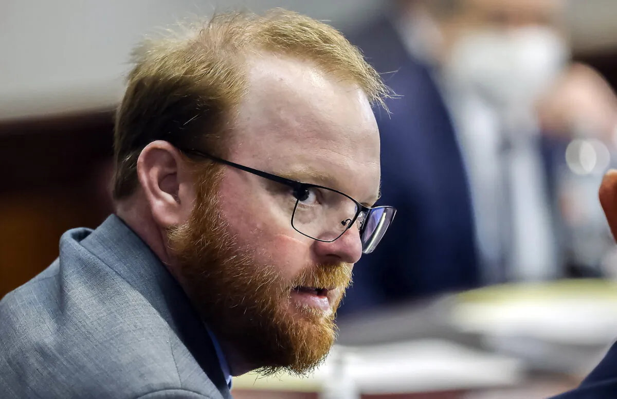 Travis McMichael looks on during the sentencing in his trial along with his father Greg McMichael and neighbor, William "Roddie" Bryan, in the Glynn County Courthouse in Brunswick, Ga., on Jan. 7, 2022. (Stephen B. Morton/Pool Photo via AP)