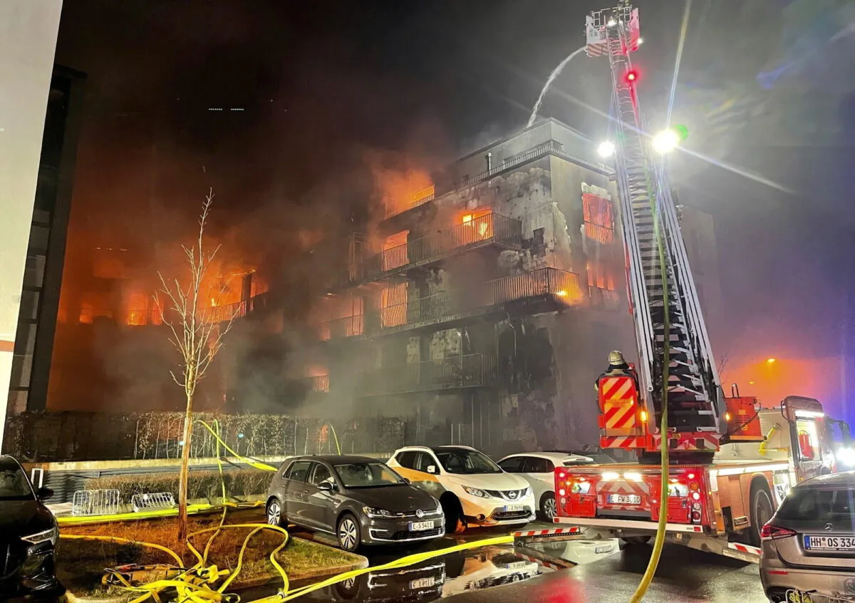 Firefighters battle a fire at a residential complex in Essen Germany, on Feb. 21, 2022. (Stephan Witte/KDF-TV/dpa via AP)