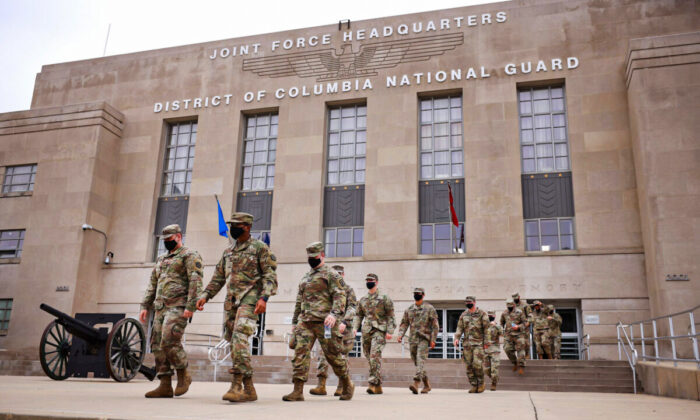 National Guard troops leave the Armory after ending their mission of providing security to the U.S. Capitol on May 24, 2021. (Kevin Dietsch/Getty Images)