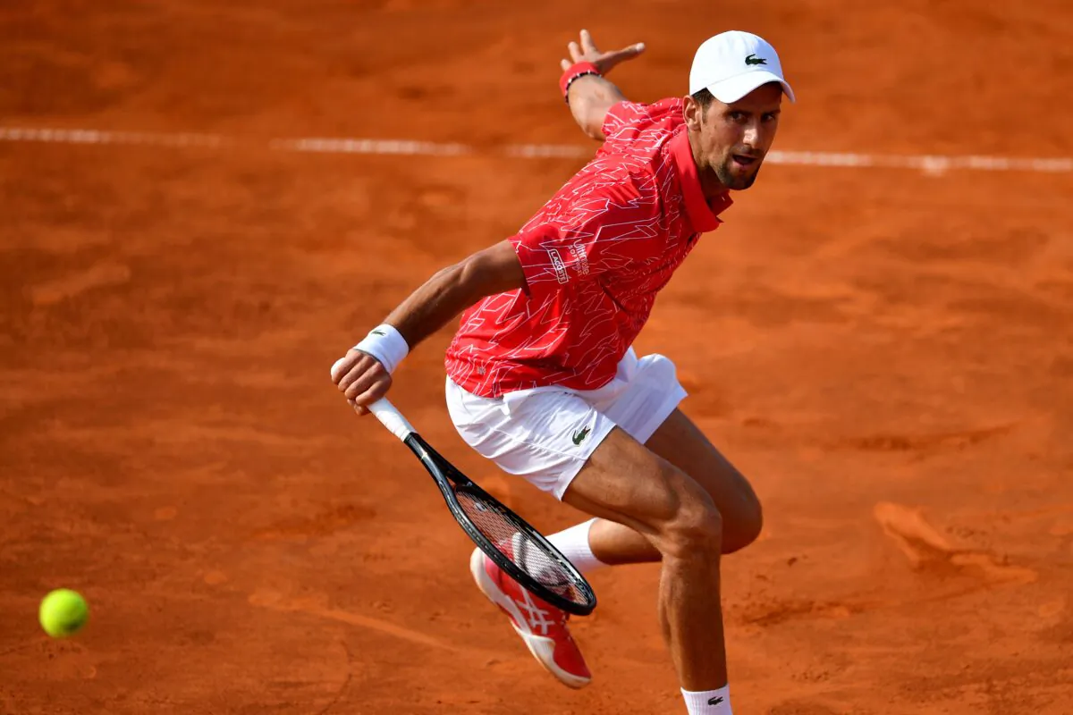 Serbian tennis player Novak Djokovic returns the ball during a single match at a charity exhibition in Belgrade, Serbia, on June 13, 2020. (Andrej Isakovic/AFP via Getty Images)