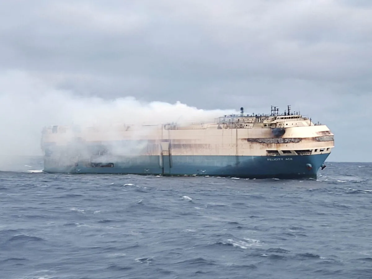 The ship, Felicity Ace, which was traveling from Emden, Germany to Davisville, in the U.S. state of Rhode Island, burns more than 100 km from the Azores islands, Portugal, on Feb. 18, 2022. (Portuguese Navy (Marinha Portuguesa)/Reuters