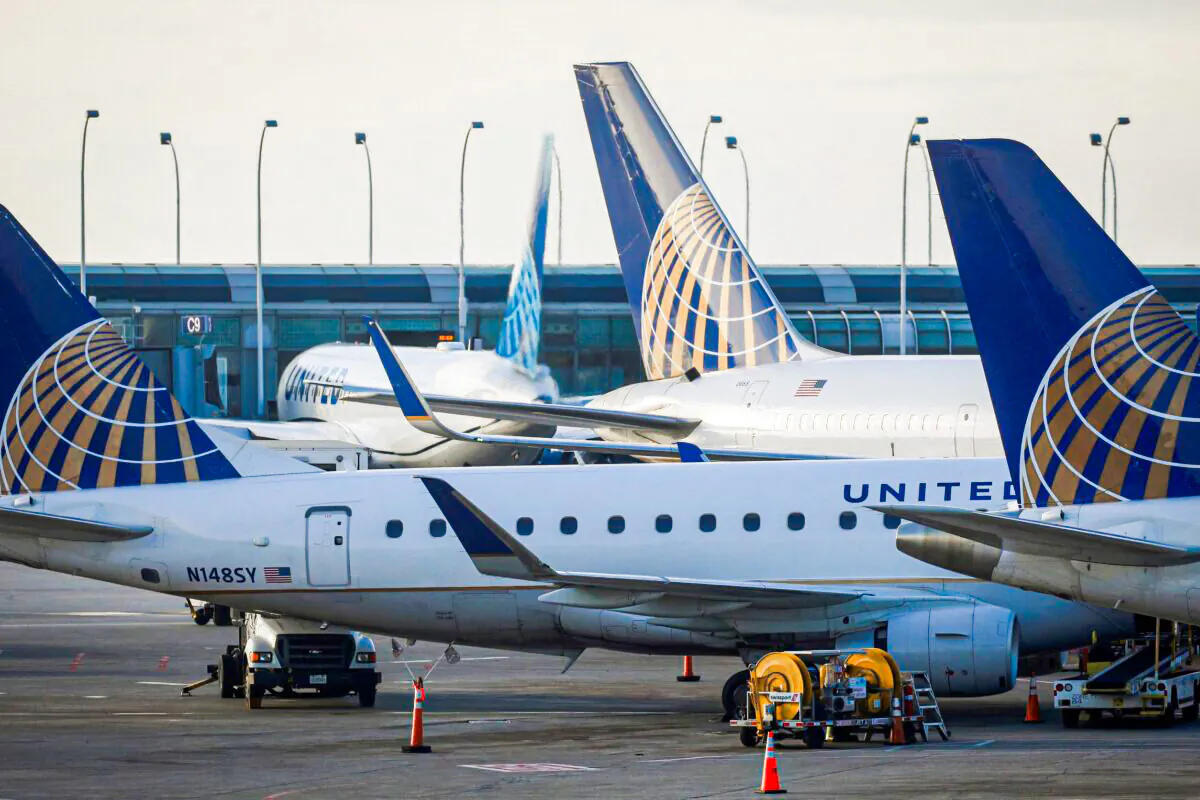 United Airlines planes are parked at their gates at O'Hare International Airport ahead of the Thanksgiving holiday in Chicago on Nov. 20, 2021. (Brendan McDermid/Reuters)