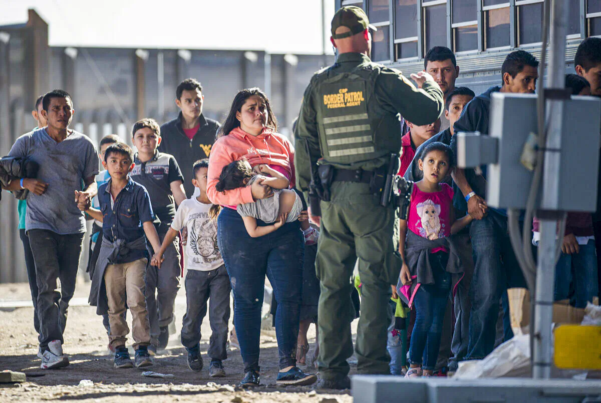 Illegal Immigrants are loaded onto a bus by U.S. Border Patrol agents after being detained when they crossed into the United States from Mexico, in El Paso, Texas, on June 1, 2019. (Joe Raedle/Getty Images)