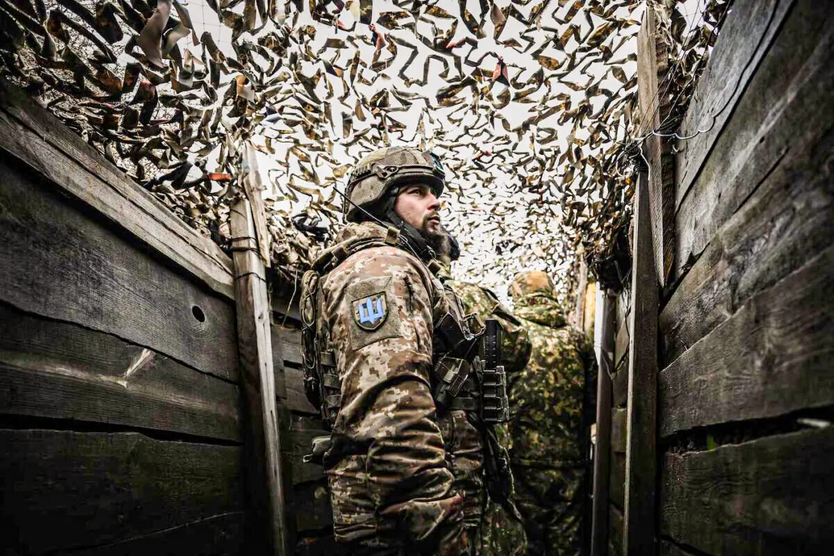 Ukrainian troops patrol at the frontline outside the town of Novoluhanske, eastern Ukraine, on Feb. 19, 2022. (Aris Messinis/AFP via Getty Images)