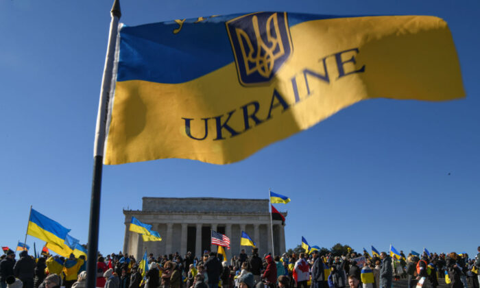 Demonstrators gather at the Lincoln Memorial to stand in solidarity with Ukraine and protest against the rising tensions between Russia and Ukraine before marching to the White House in Washington on Feb. 20, 2022. Attendees called for President Joe Biden to take a stronger stance on deterring Russia from invading Ukraine and demanded the end of Russia's occupation of Crimea. (Kenny Holston/Getty Images)