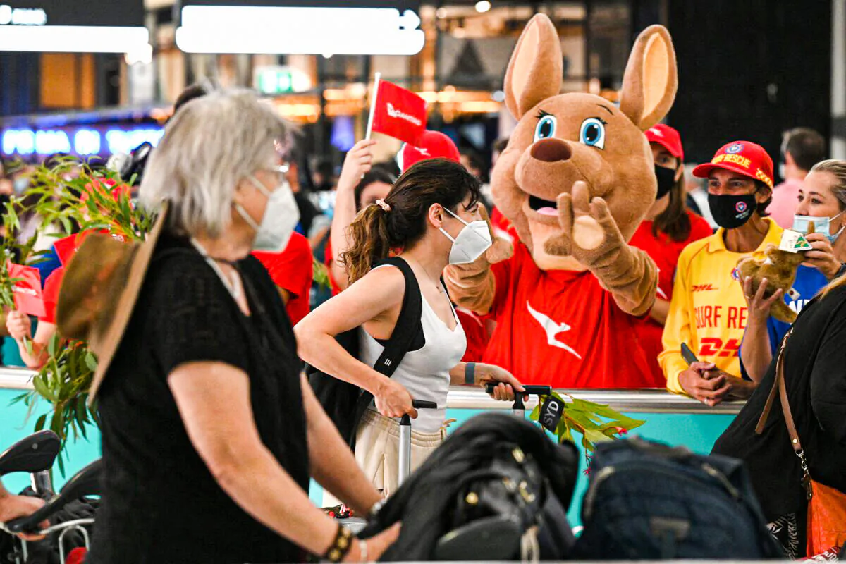 A mascot welcomes passengers upon arrival at the Sydney International Airport in Sydney, Australia, on February 21, 2022. (Saeed Khan/AFP via Getty Images)