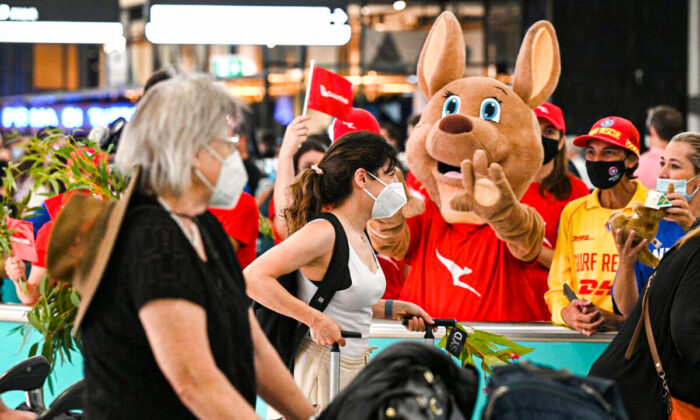 A mascot welcomes passengers upon arrival at the Sydney International Airport in Sydney, Australia, on February 21, 2022. (Saeed Khan/AFP via Getty Images)