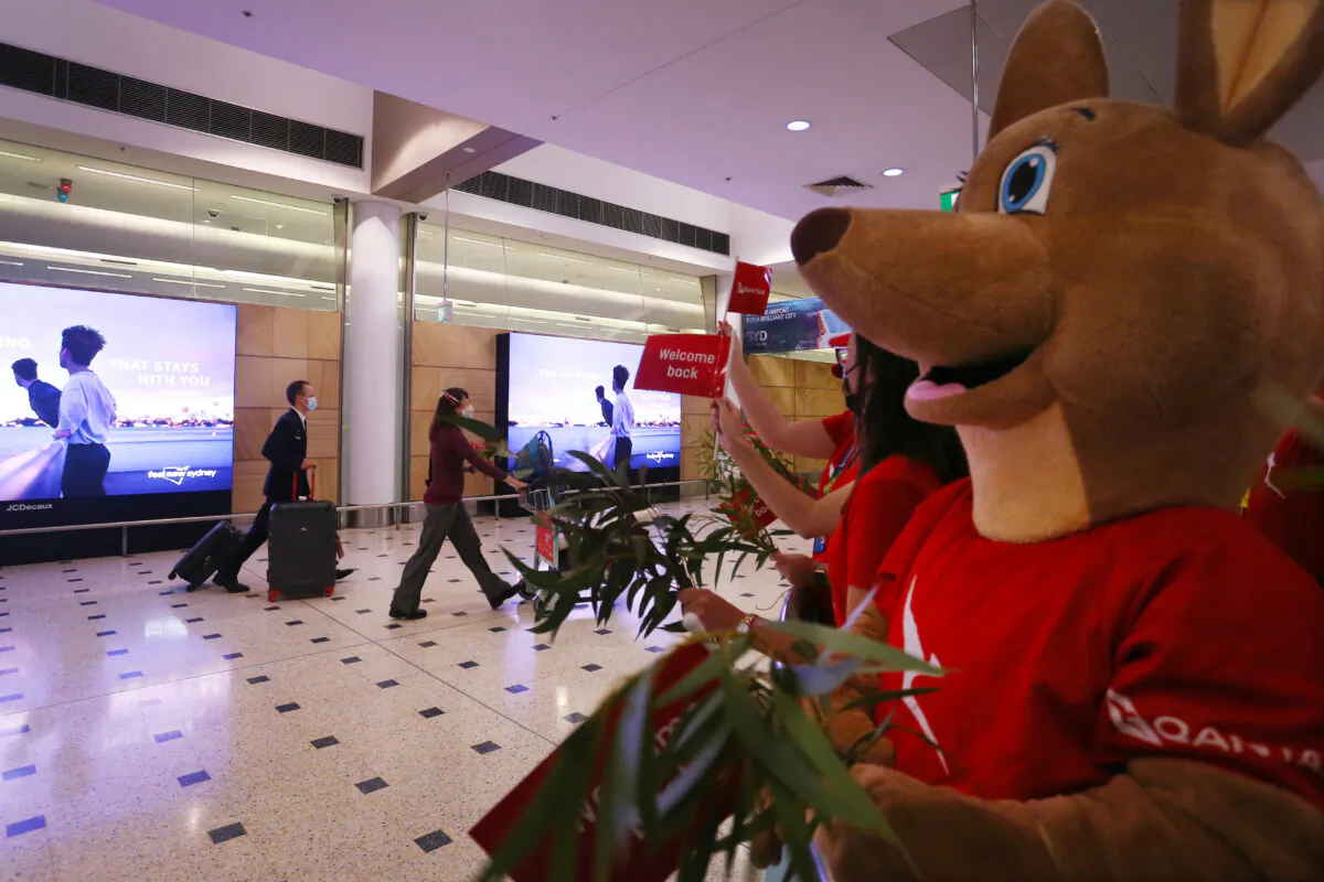 Passengers arrive at Sydney Airport in Sydney, Australia, on Feb. 21, 2022. (Lisa Maree Williams/Getty Images)