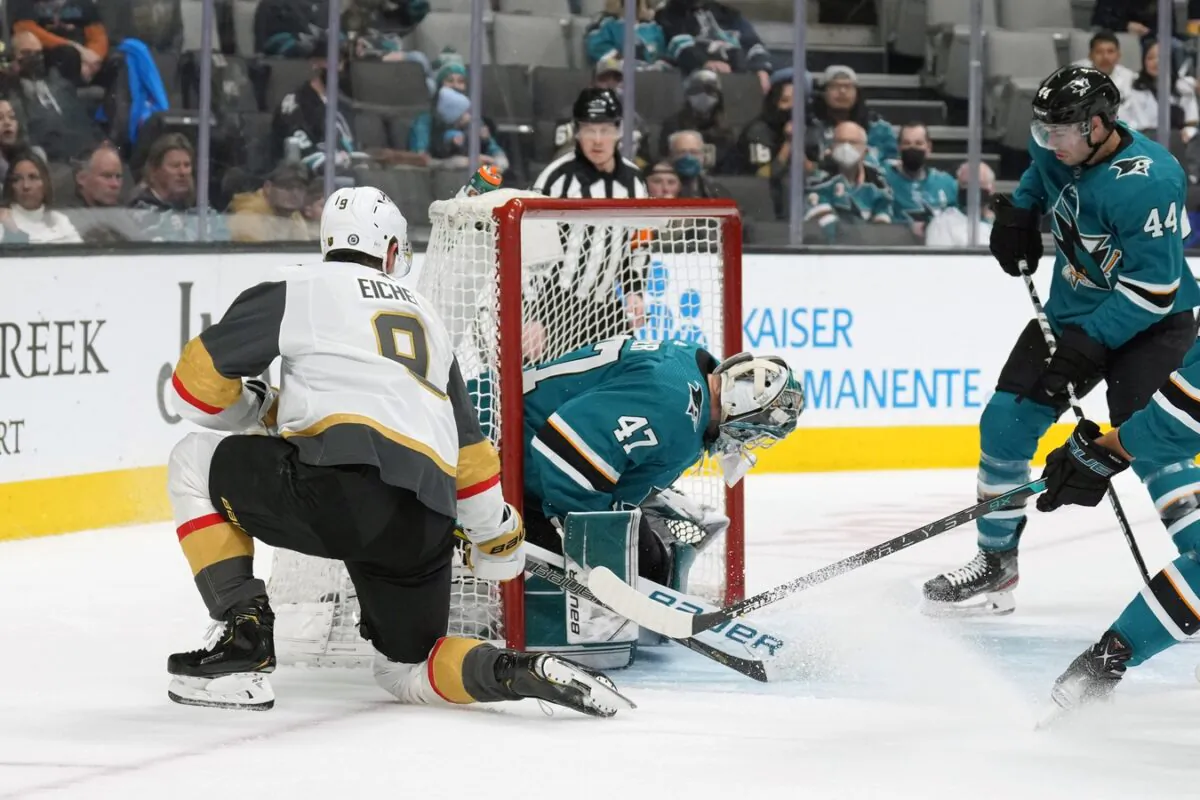 Vegas Golden Knights center Jack Eichel (9) shoots past San Jose Sharks goaltender James Reimer (47) to score a goal during the first period at SAP Center in San Jose, Calif., on Feb. 20, 2022. (Darren Yamashita/USA TODAY Sports via Field Level Media)
