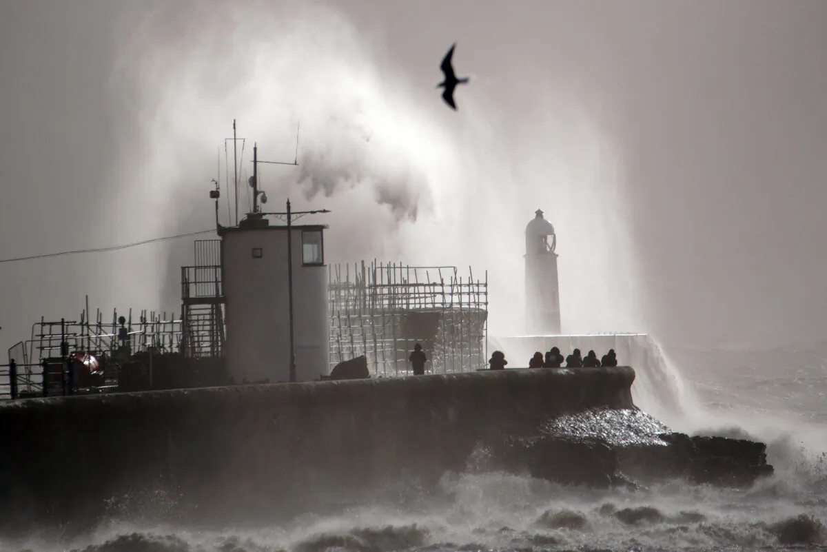 Huge waves hitting the sea wall at Porthcawl, Wales, after Storm Franklin moved in overnight, on Feb. 21, 2022. (PA)