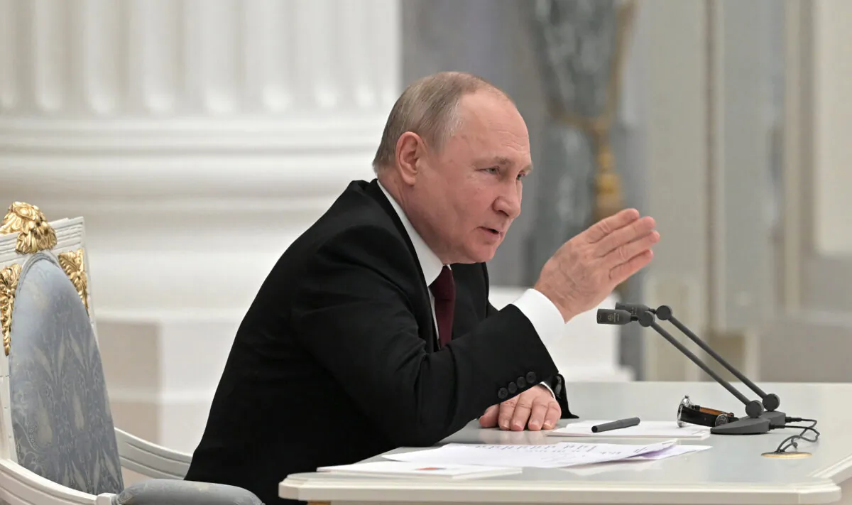 Russian President Vladimir Putin chairs a meeting with members of the Security Council in Moscow on Feb. 21, 2022. (Alexey Nikolsky/Sputnik/AFP via Getty Images)