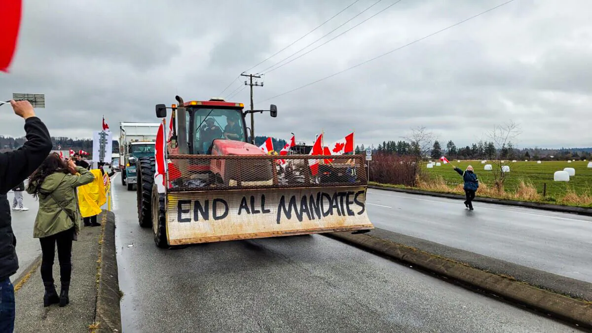 Protesters demonstrate against COVID-19 mandates near the Pacific Highway border crossing in Surrey, B.C., on Feb. 19, 2022. (Jeff Sandes/The Epoch Times)