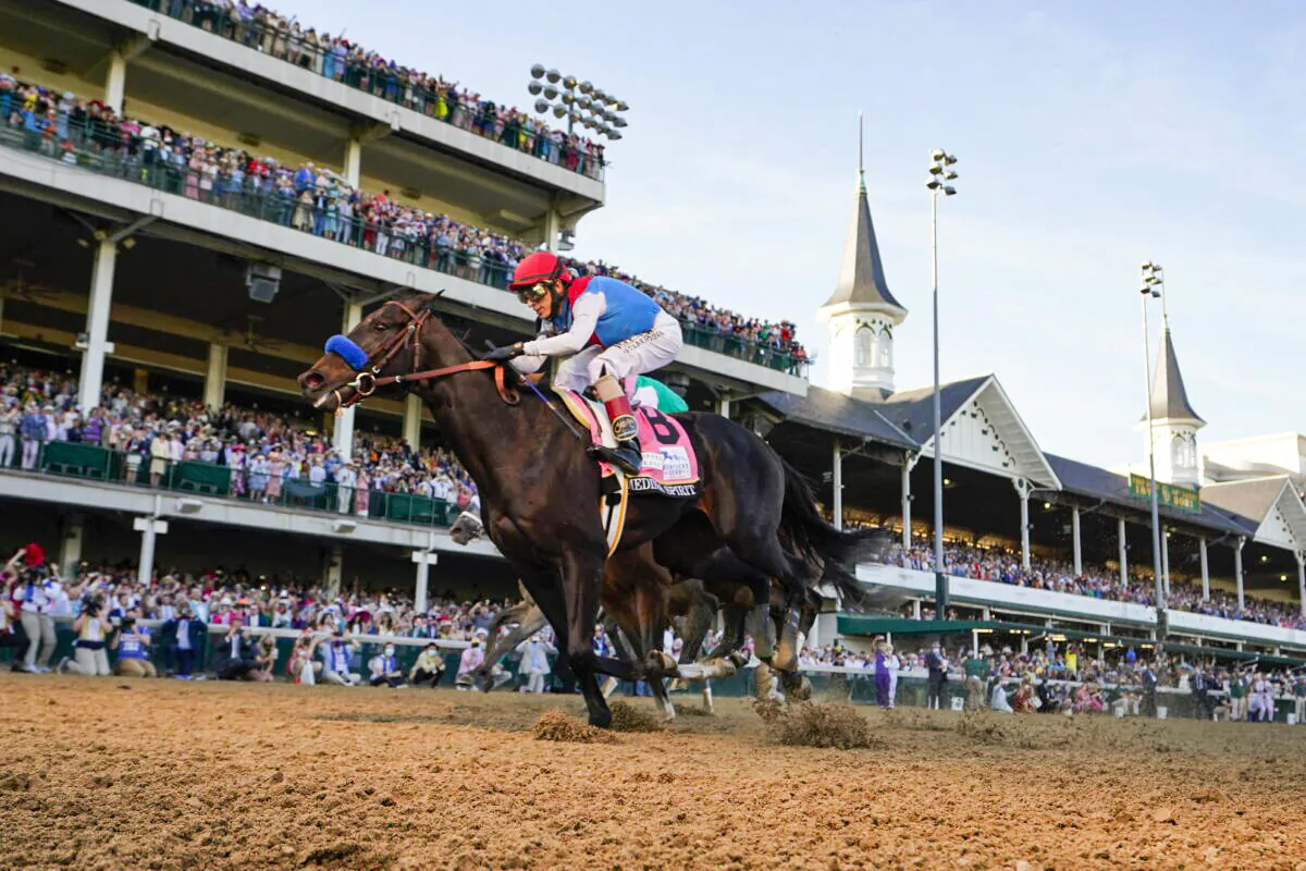 John Velazquez riding Medina Spirit crosses the finish line to win the 147th running of the Kentucky Derby at Churchill Downs in Louisville, Ky., on May 1, 2021. (Jeff Roberson/AP Photo)