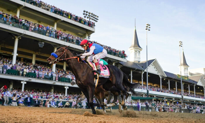 John Velazquez riding Medina Spirit crosses the finish line to win the 147th running of the Kentucky Derby at Churchill Downs in Louisville, Ky., on May 1, 2021. (Jeff Roberson/AP Photo)