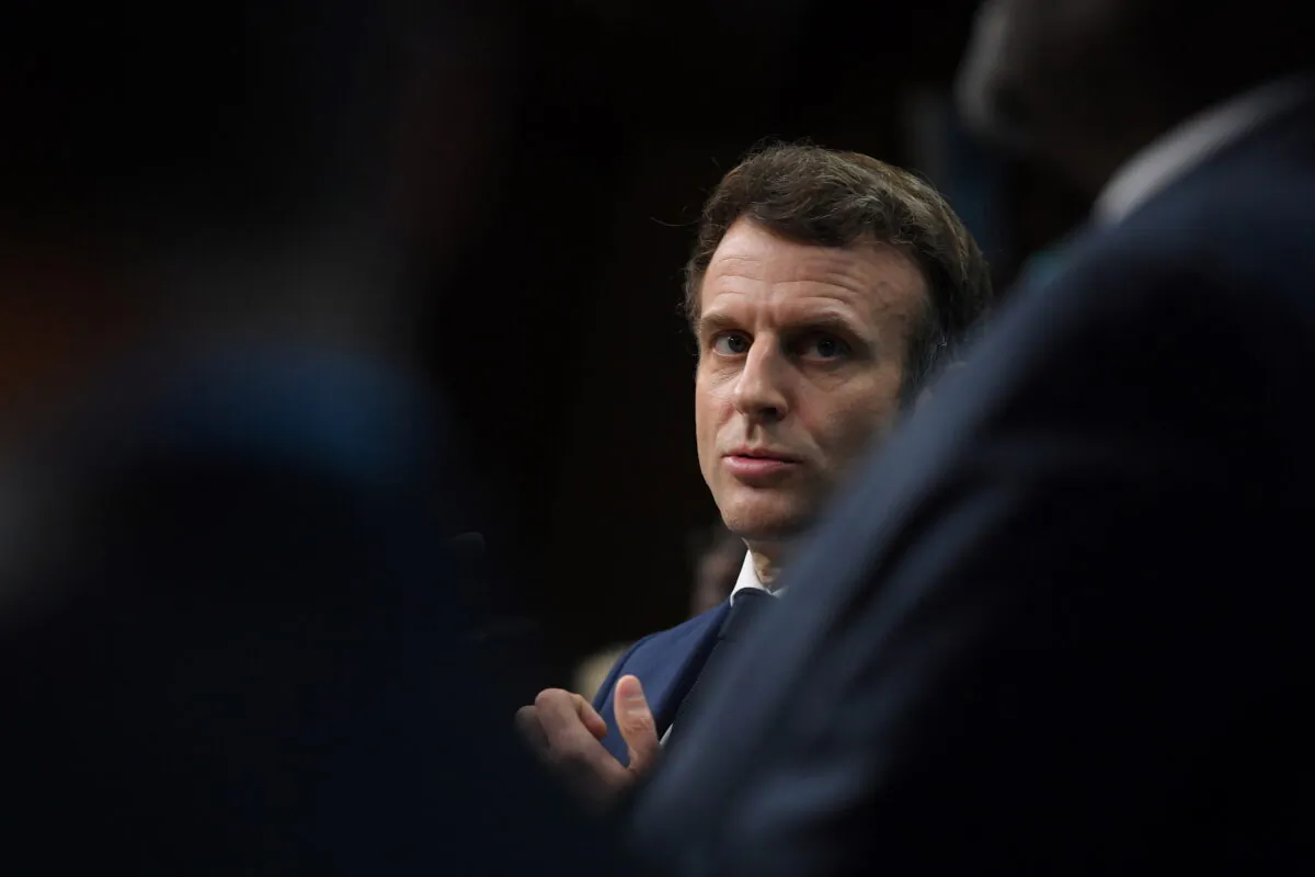 French President Emmanuel Macron attends a news conference on the second day of the European Union–African Union summit at The European Council Building in Brussels, on Feb. 18, 2022. (John Thys/Pool via Reuters)