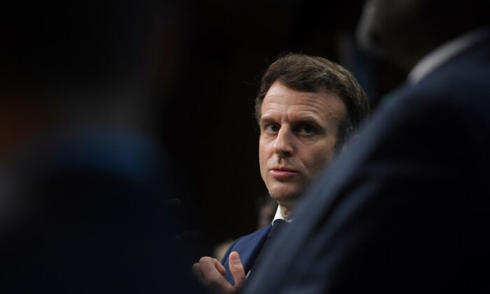 French President Emmanuel Macron attends a news conference on the second day of the European Union–African Union summit at The European Council Building in Brussels, on Feb. 18, 2022. (John Thys/Pool via Reuters)
