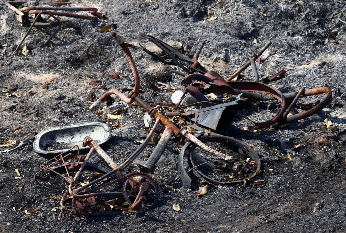Destroyed bicylces lie on charred earth after a wildfire in a region hit by drought and high temperatures, near Santo Tome, province of Corrientes, Argentina, on Feb. 21, 2022. (Matias Baglietto/Reuters)