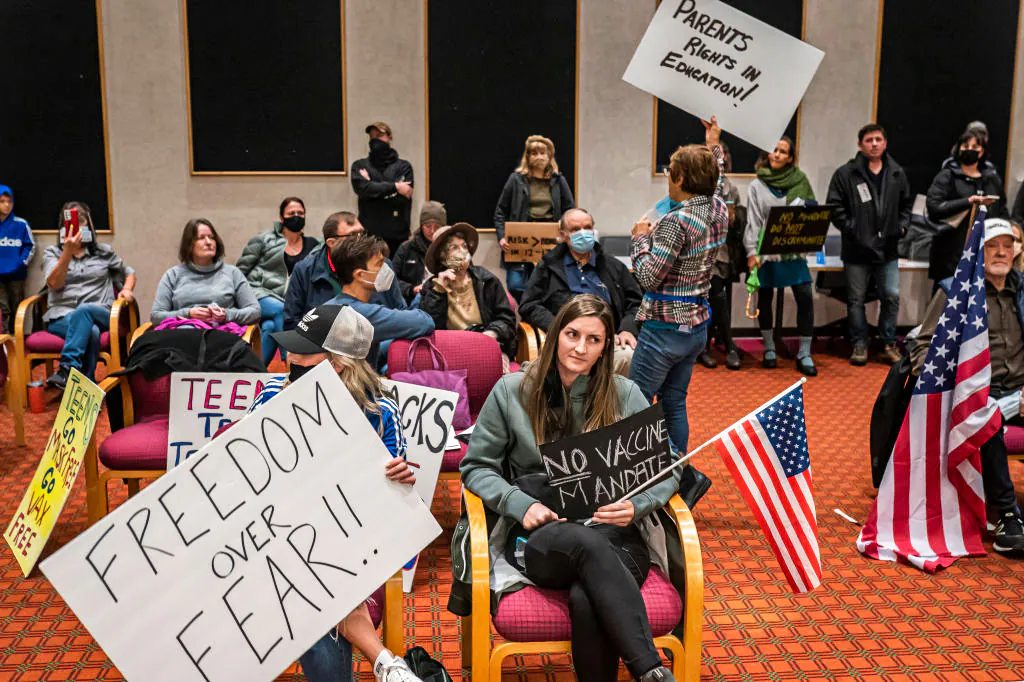 Anti-vaccine mandate protesters gather during a Portland Public Schools board meeting to discuss a proposed vaccine mandate for students in Portland, Ore., on Oct. 26, 2021. (Nathan Howard/Getty Images)