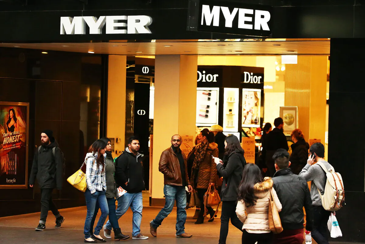 People walk past the Myer Melbourne department store on Bourke Street in Melbourne, Australia on July 30, 2015. (Scott Barbour/Getty Images)