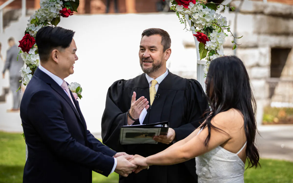 Orange County Clerk-Recorder Hugh Nguyen performs a wedding ceremony at Old Orange County Courthouse in Santa Ana, Calif., on Feb. 22, 2022. (John Fredricks/The Epoch Times)