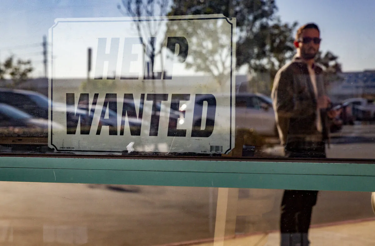 A help wanted sign hangs in a restaurant in Fountain Valley, Calif., on Jan. 27. 2022. (John Fredricks/The Epoch Times)