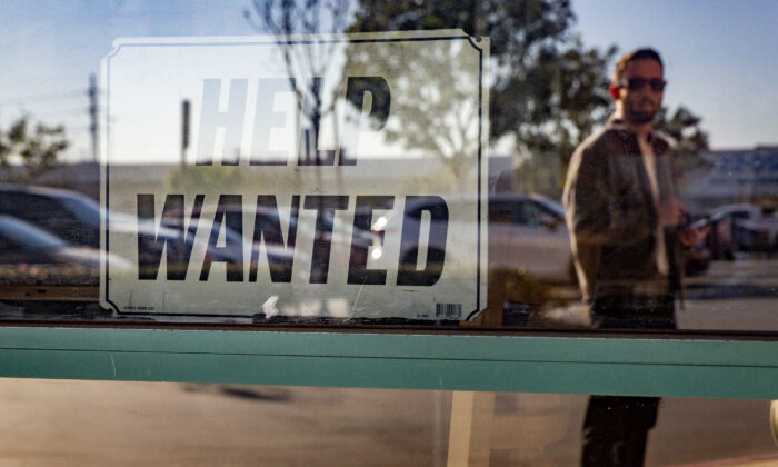 A help wanted sign hangs in a restaurant in Fountain Valley, Calif., on Jan. 27. 2022. (John Fredricks/The Epoch Times)