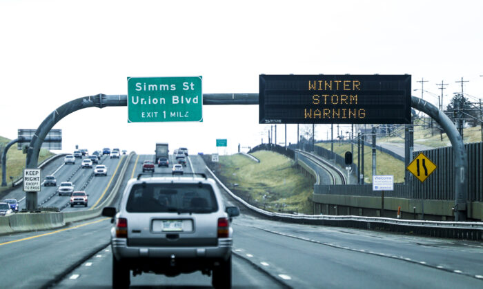 A sign on Highway 6 warns drivers of a winter storm approaching in Denver, Colo. on March 12, 2021. (Michael Ciaglo/Getty Images)