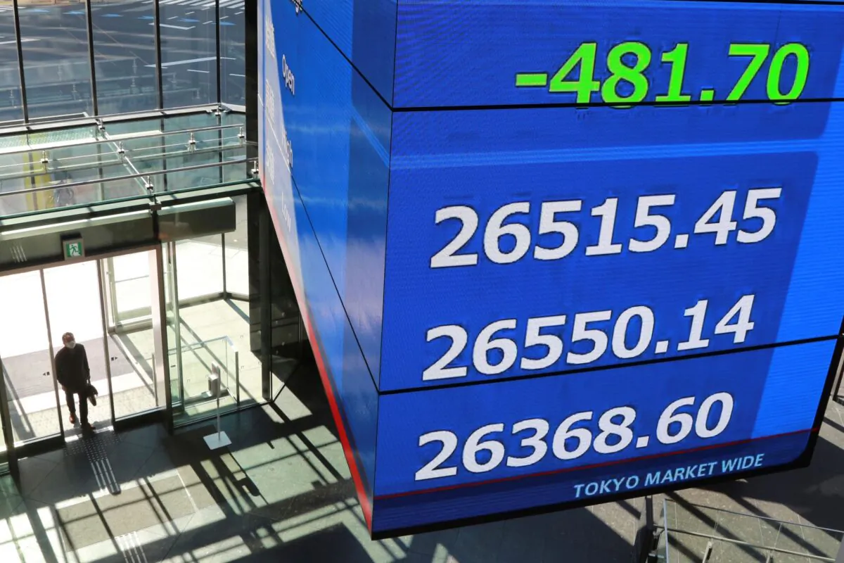An electronic stock board is displayed at a conference hall in Tokyo, on Feb. 22, 2022. (Koji Sasahara/AP Photo)