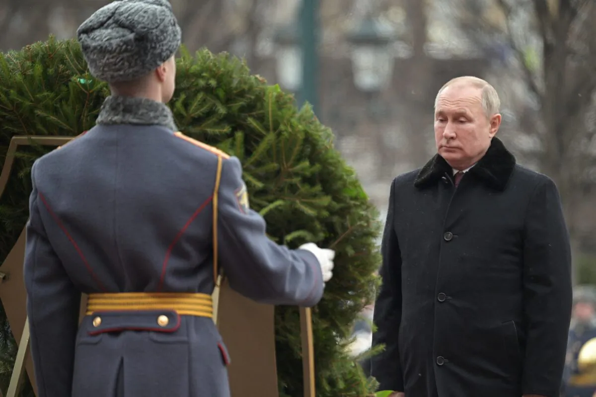 Russian President Vladimir Putin takes part in a wreath laying ceremony at the Tomb of the Unknown Soldier by the Kremlin Wall on the Defender of the Fatherland Day in Moscow, Russia Feb. 23, 2022. (Sputnik/Aleksey Nikolskyi/Kremlin via Reuters)