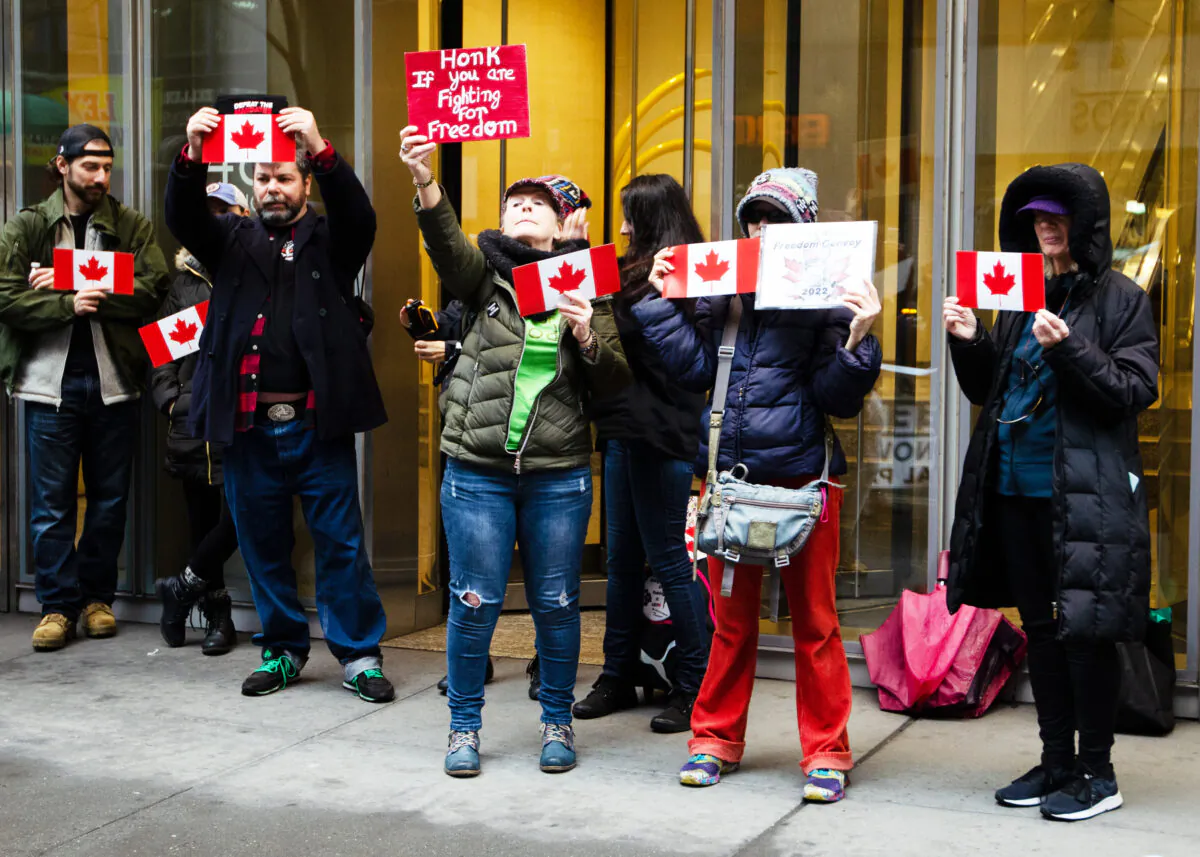 New Yorkers rally in solidarity of the Canadian truckers outside the Canadian Consulate’s building in midtown Manhattan on Feb. 22, 2022. (Dave Paone/The Epoch Times)