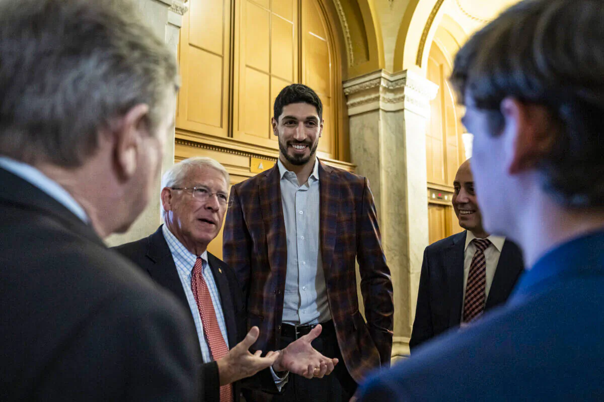 (L-R) Sen. Roger Wicker (R-Miss.) speaks with former NBA player Enes Kanter Freedom at the U.S. Capitol, in Washington, on Feb. 17, 2022. (Drew Angerer/Getty Images)