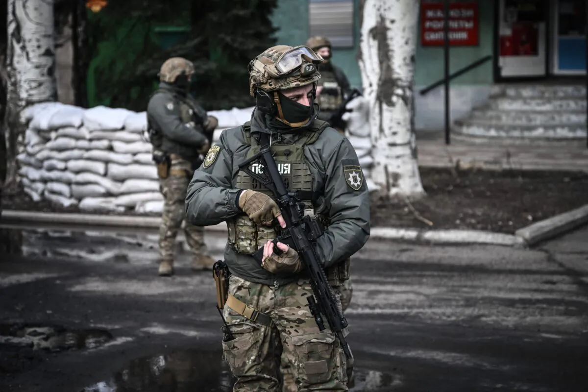 Ukrainian troops patrol in the town of Novoluhanske, eastern Ukraine, on Feb. 19, 2022. (Aris Messinis/AFP via Getty Images)