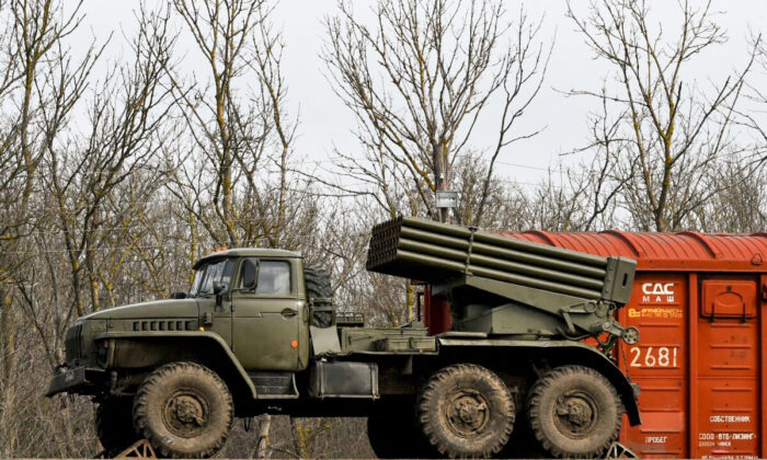 Russian military vehicles are seen loaded on train platforms some 50 kilometers (30 miles) off the border with the self-proclaimed Donetsk People's Republic in Russia's southern Rostov region on Feb. 23, 2022. (Stringer/AFP via Getty Images)