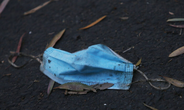A face mask is seen on the ground in Redfern in Sydney, Australia on September 11, 2021. (Photo by Lisa Maree Williams/Getty Images)