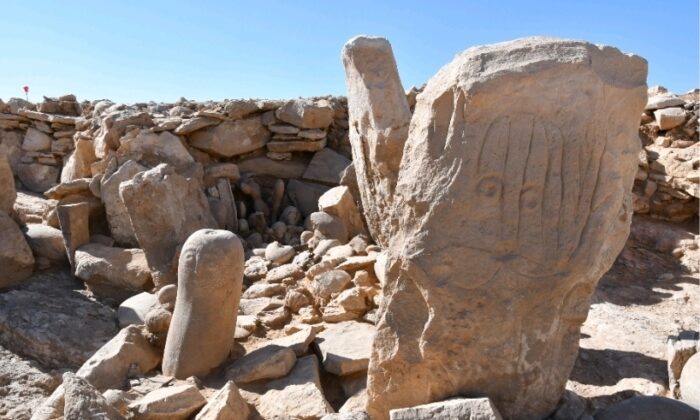 Two carved standing stones at a remote Neolithic site in Jordan’s eastern desert. (Tourism Ministry via AP)