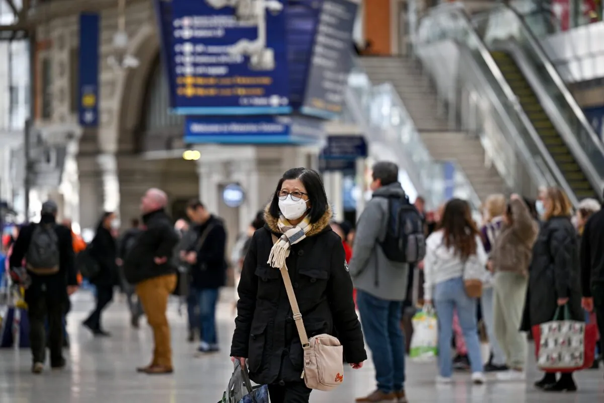 Commuters are seen in Waterloo station in London on Feb. 23, 2022. (Jeff J Mitchell/Getty Images)
