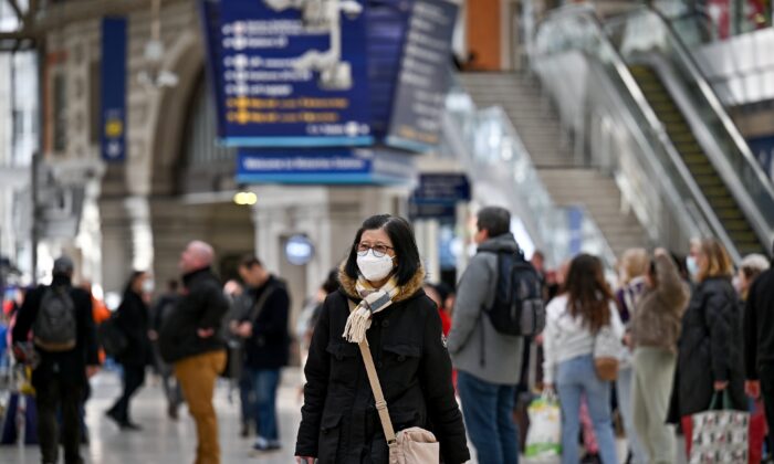 Commuters are seen in Waterloo station in London on Feb. 23, 2022. (Jeff J Mitchell/Getty Images)