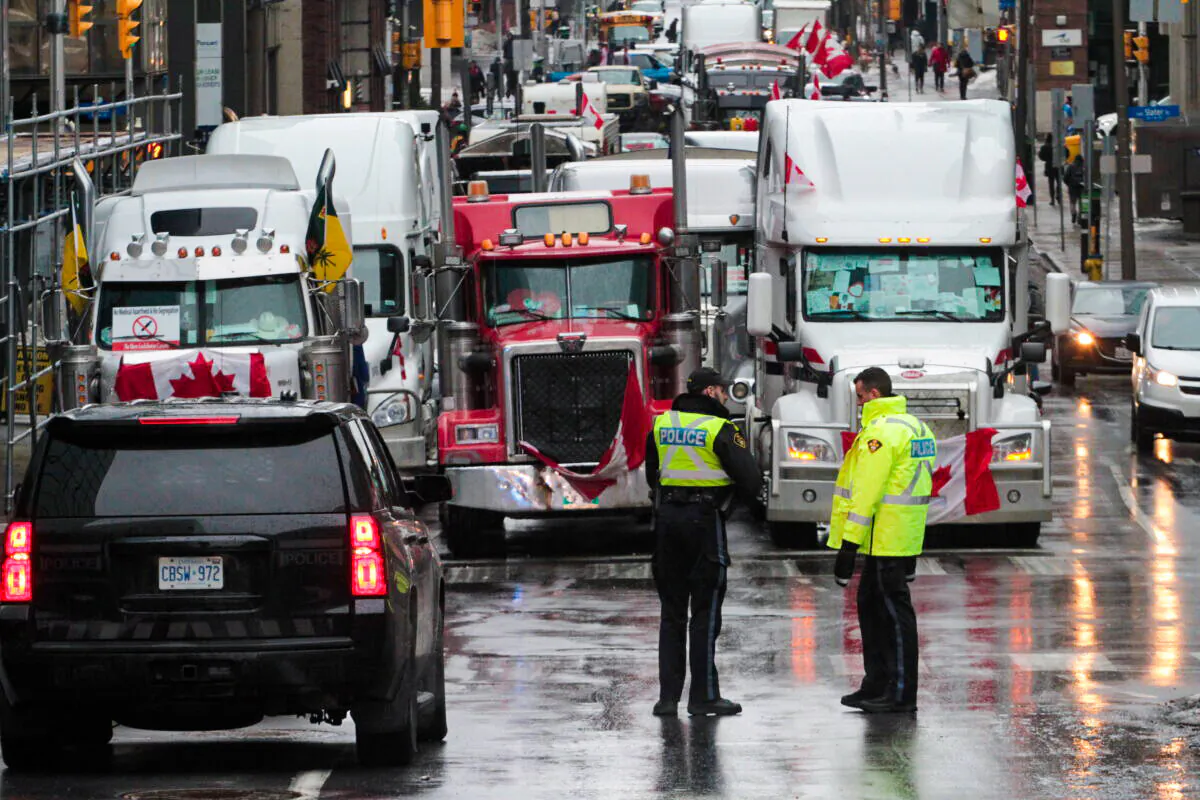 There is an increased police presence in and around the blockaded section of downtown Ottawa on Feb. 17, 2022. (Richard Moore/The Epoch Times)