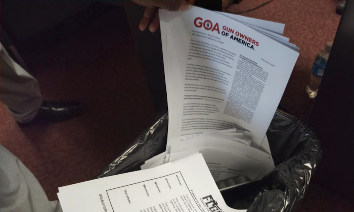 Petitions gathered by members of gun rights organizations were thrown into a trashcan By Florida State Rep. Chuck Brannan's legislative aide soon after being delivered to the office. (Courtesy of Luis Valdes)
