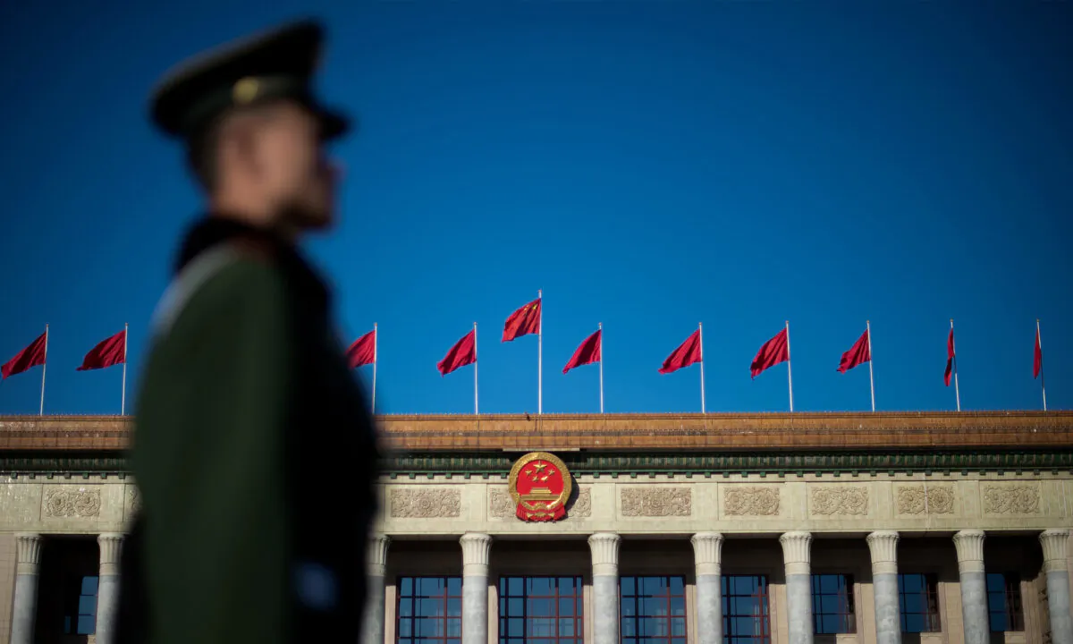 A paramilitary policeman stands guard ahead of the closing session of the Chinese People's Political Consultative Conference (CPPCC) at the Great Hall of the People in Beijing, on March 13, 2017. (Nicolas Asfouri/AFP via Getty Images)