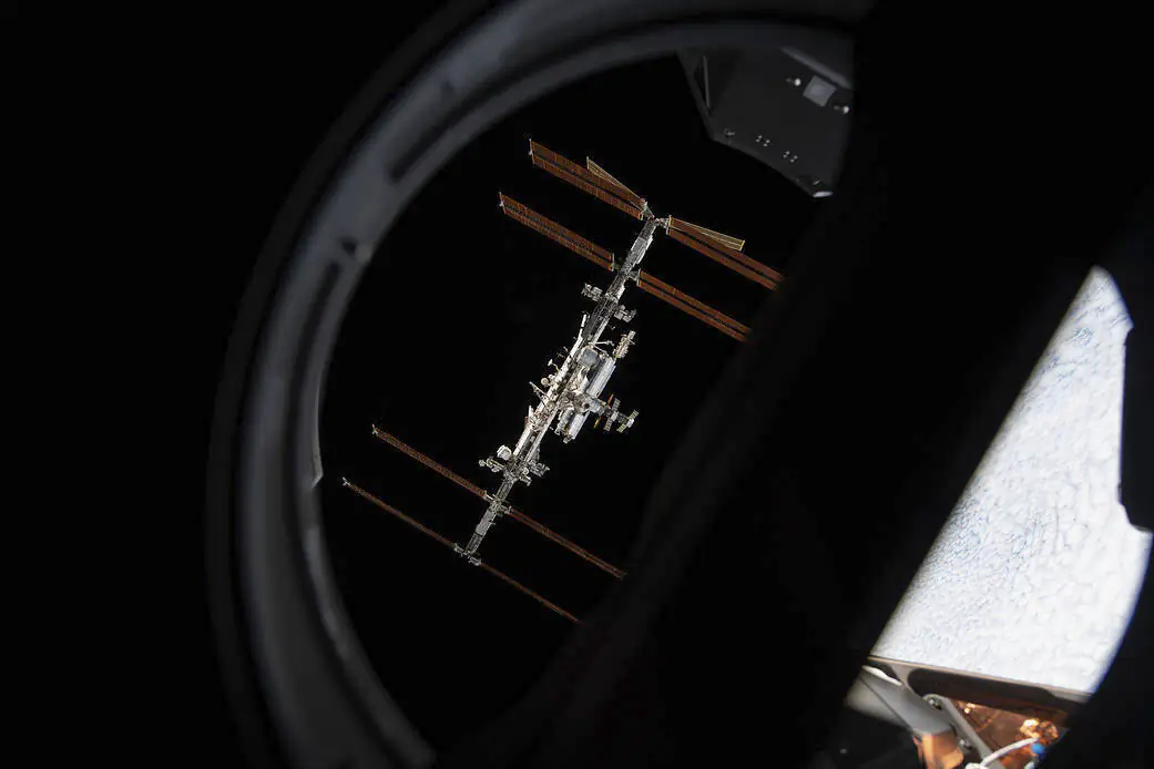 The International Space Station is pictured from inside a window aboard the SpaceX Crew Dragon Endeavour on Nov. 8, 2021. (NASA via AP)