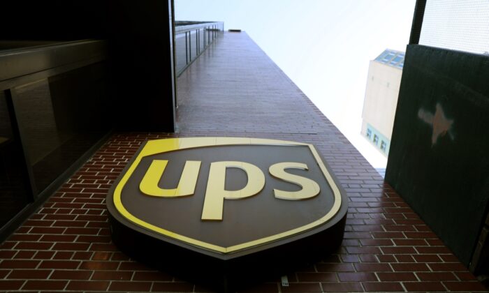 A United Parcel Service (UPS) sign is displayed outside of a UPS facility during a job fair in New York, on Nov. 1, 2019. (Spencer Platt/Getty Images)
