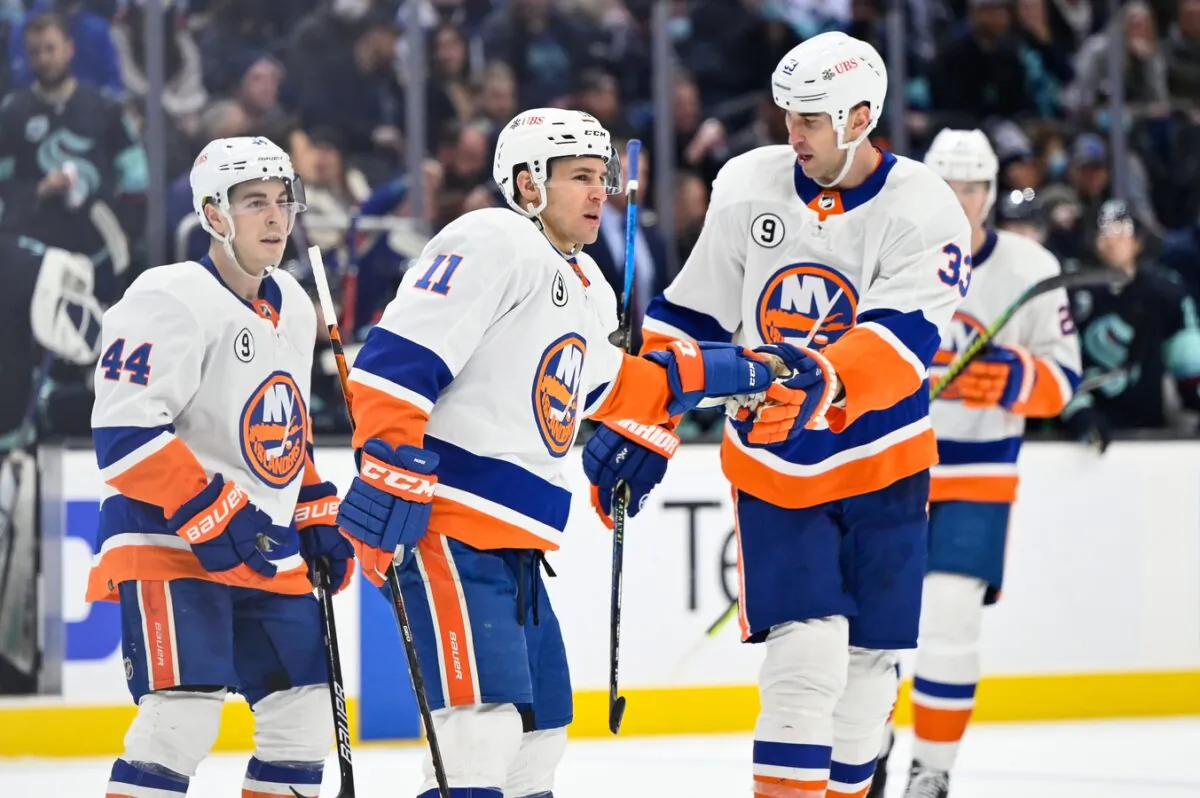 New York Islanders left wing Zach Parise (11) celebrate with defenseman Zdeno Chara (33) after scoring a goal against the Seattle Kraken, during the third period at Climate Pledge Arena in Seattle on Feb. 22, 2022. (Steven Bisig/USA TODAY Sports via Field Level Media)