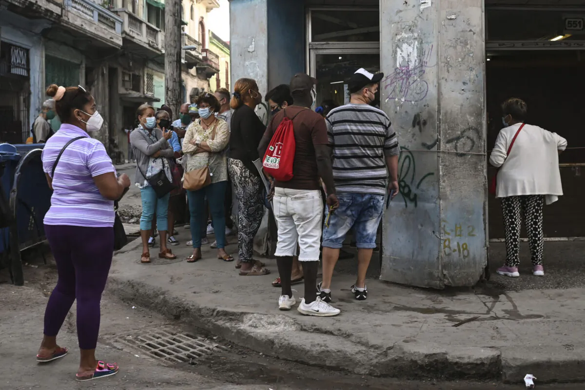 Cubans queue to by food outside a store in Havana, Cuba, on Jan. 6, 2022. (YAMIL LAGE/AFP via Getty Images)