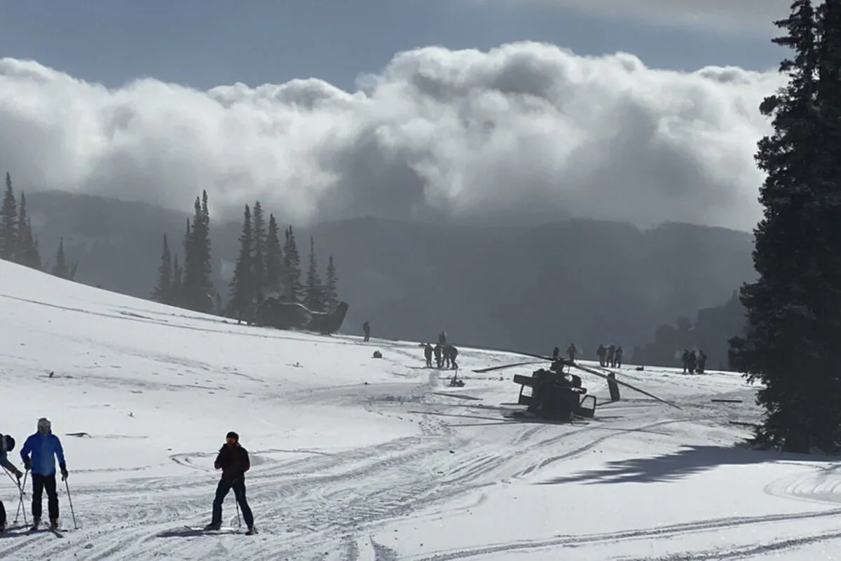 A scene where a pair of Utah National Guard helicopters were involved in an accident near Snowbird Ski Resort in Snowbird, Utah on Feb. 22, 2022. (@LifterMike93 via AP)