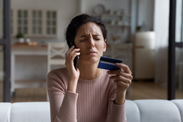 Unhappy,Woman,Talking,On,Smartphone,With,Bank,Client,Support,Operator