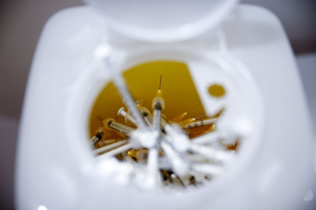 Syringes used for injecting the vaccine against the coronavirus disease (COVID-19) are seen at a Red Cross vaccination center by Termini main train station in Rome, Italy, on Jan. 10, 2022. (Guglielmo Mangiapane/Reuters)