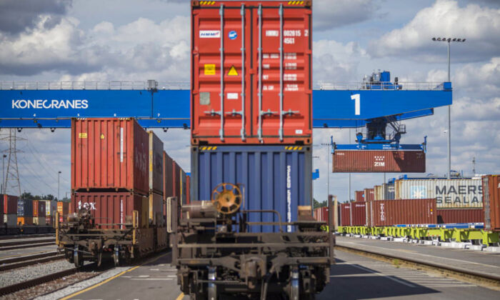A rail mounted gantry crane lifts a 40-foot shipping container and loads it onto a rail car at the Georgia Ports Authority Mason Mega Rail Terminal Savannah. (AP Photo/Stephen B. Morton, File)